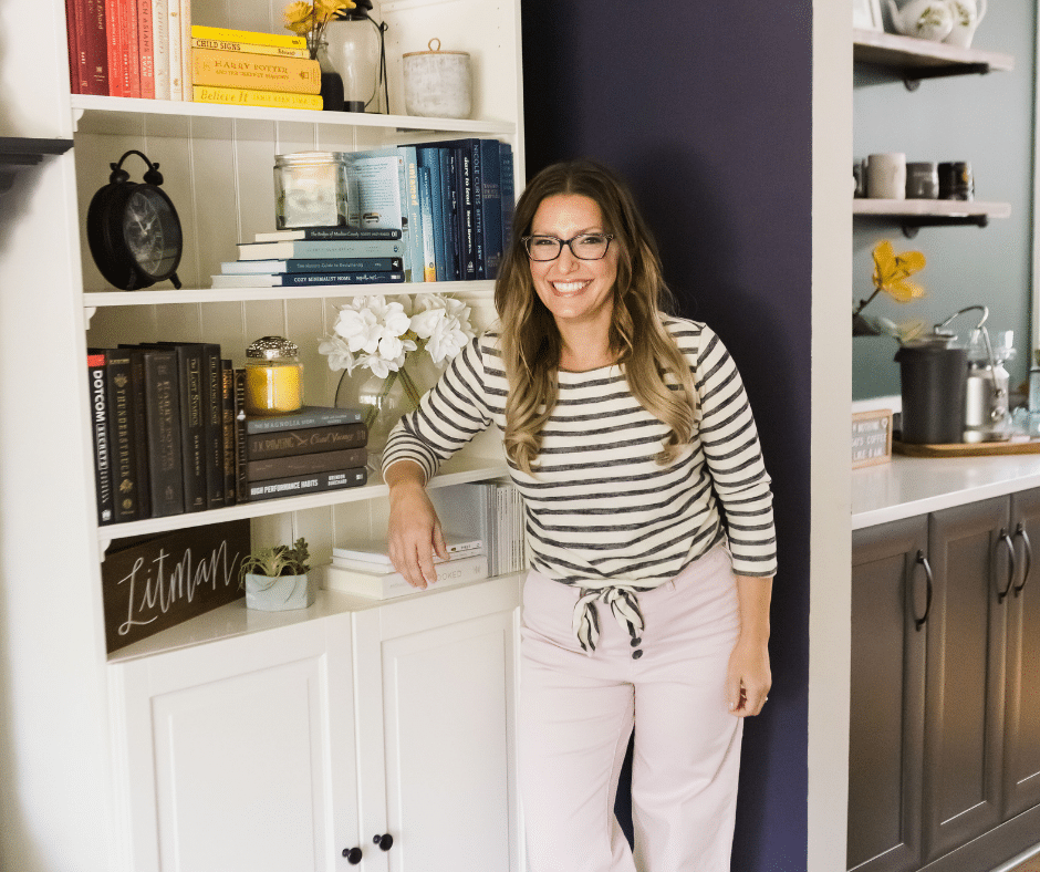 the Organized Mama next to bookshelf